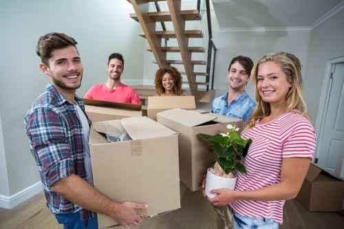 Workers using careful manual handling during a property move