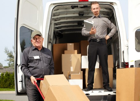 Chelsea man and van loading furniture carefully