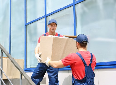 Removal team preparing a Chelsea home move with boxes and furniture