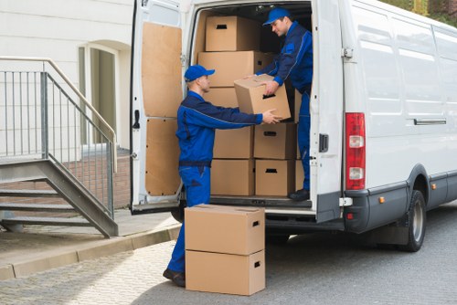 Movers packing and loading furniture for a flat move in Chelsea