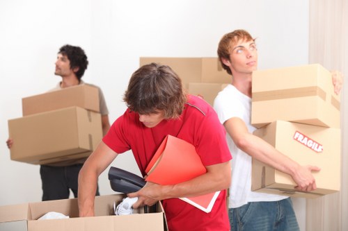 Removal crew unloading items at a Chelsea home