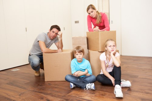 Professional movers transporting furniture for a Chelsea home relocation