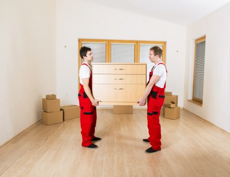Local moving team preparing packed boxes for transport in Chelsea